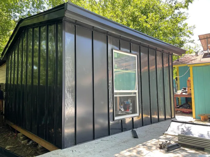 Black standing seam metal wall panels for Roof Inspection in Southlake