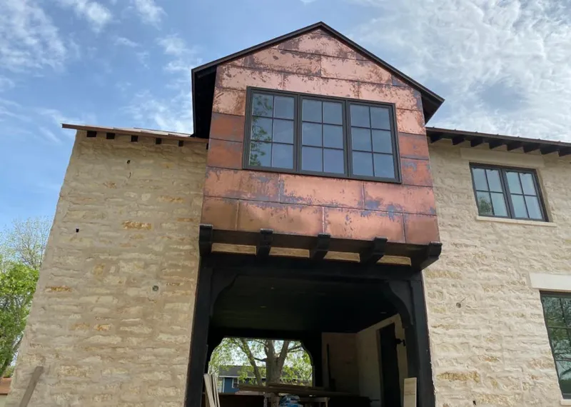 Copper metal panel facade on a stone building for Metal Roof Coating in Southlake