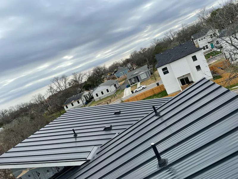 Standing seam metal roof panels with vents for Skylight Repair in Southlake